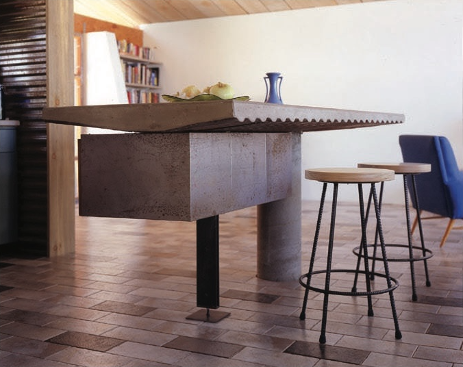 Kitchen Island made out of cast in place concrete and steel.